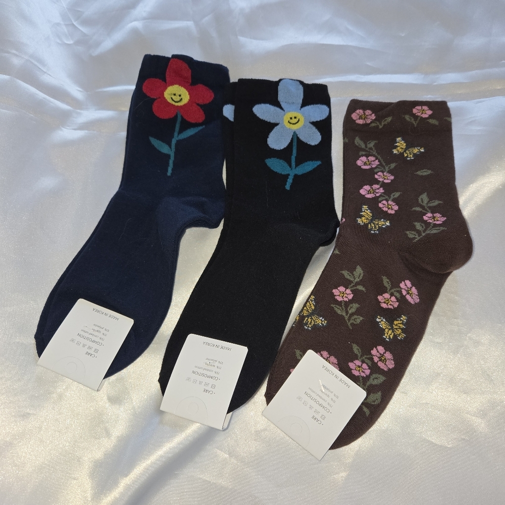 Three Pairs of Floral Patterned Socks- Black, Blue, Brown
